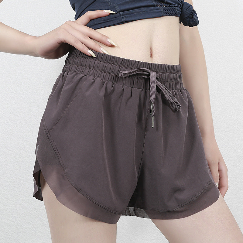 Pantalón corto deportivo de cintura alta de secado rápido para mujer.