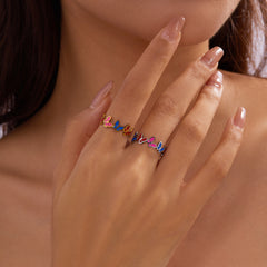 Anillo de acero inoxidable para mujer con aberturas de flores de colores dulces ajustable